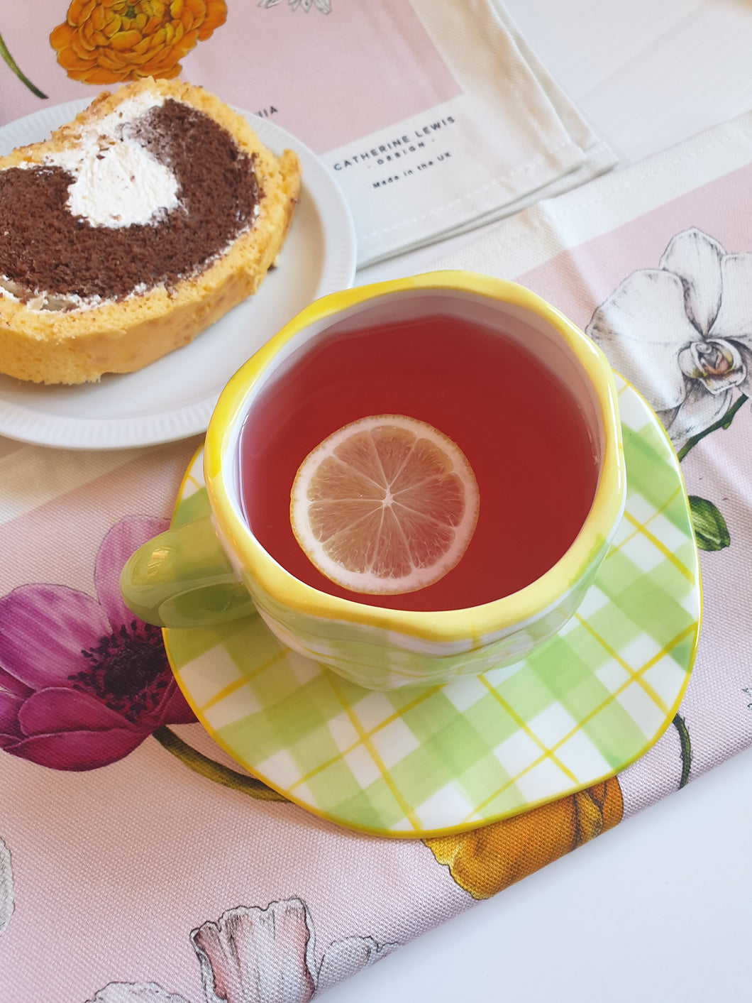 Green gingham ceramic mug with saucer